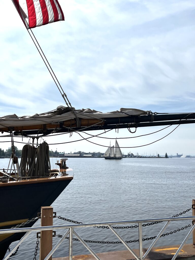A schooner plies the waters of Duluth Harbor during the recent Festival of Sail. Nearly a dozen tall ships made their way to Duluth, Minnesota for the biannual event. Photo by Jerry Nelson.