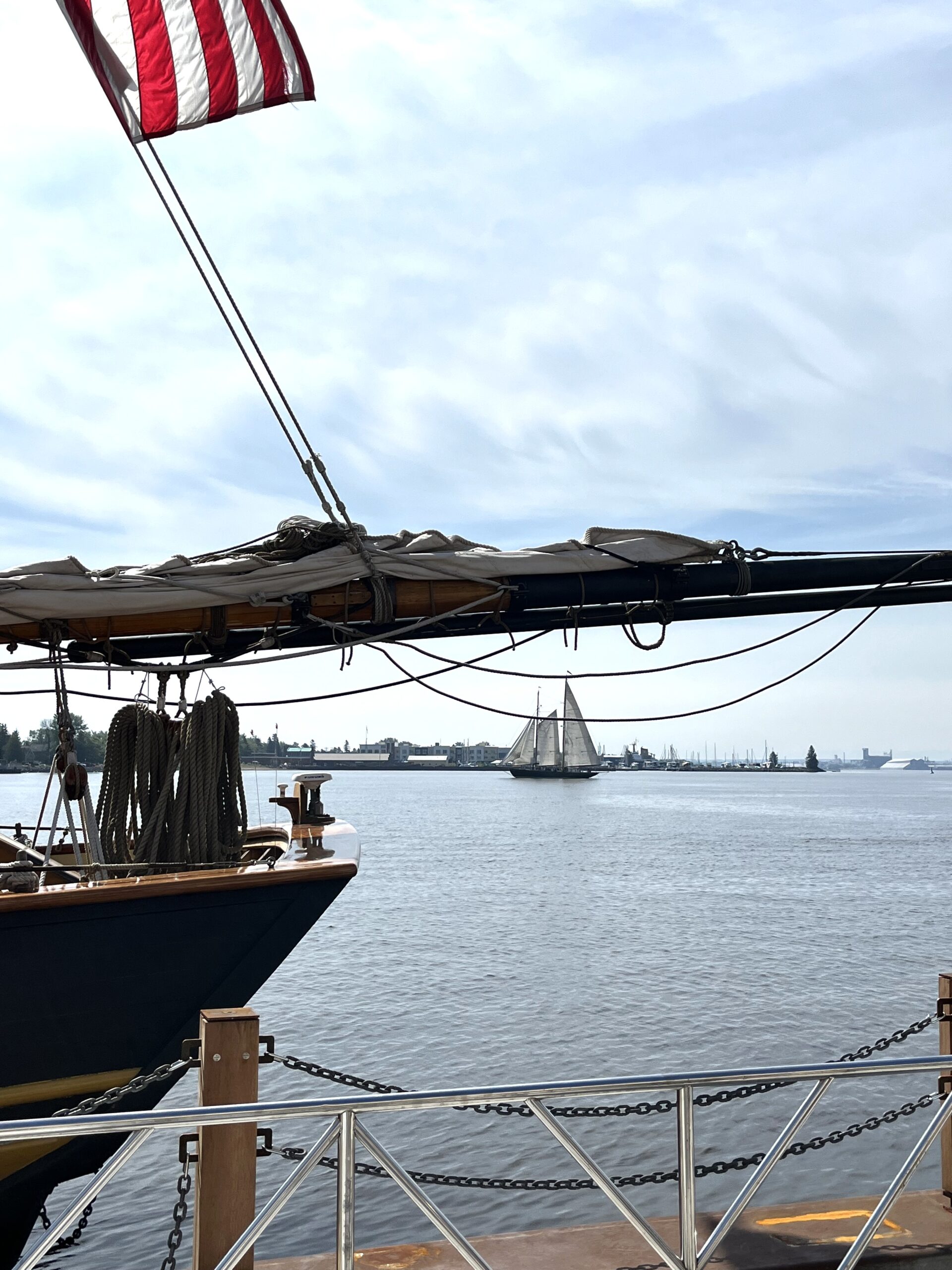 A schooner plies the waters of Duluth Harbor during the recent Festival of Sail. Nearly a dozen tall ships made their way to Duluth, Minnesota for the biannual event. Photo by Jerry Nelson.
