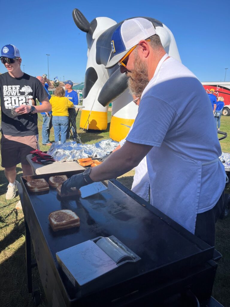 Jon Rogers of Valley Queen Cheese flipping sandwiches