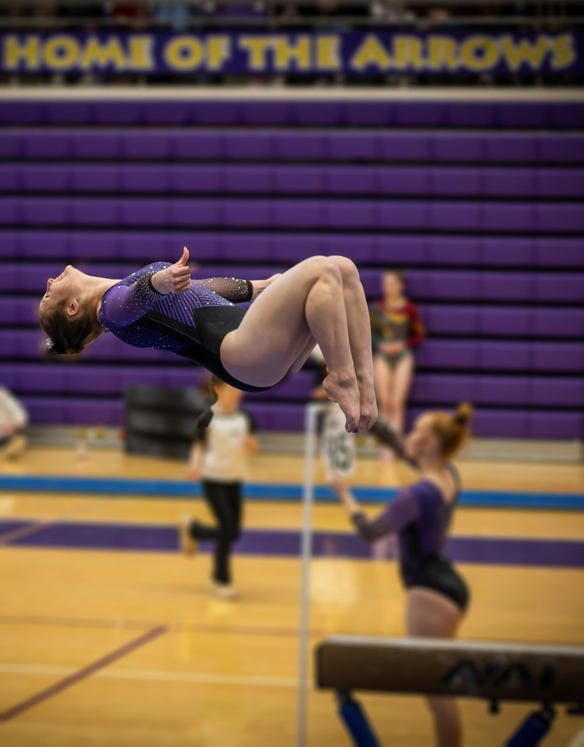 Ashlynn Andrews dismounts from the beam