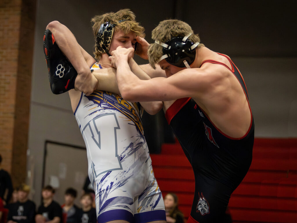 Landen Lewis of Watertown gets a single leg and looks for a takedown against his opponent of Brandon Valley