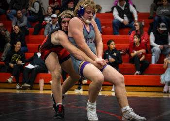Rylan Johnson of Watertown attempts to escape from his Brandon Valley Opponent
