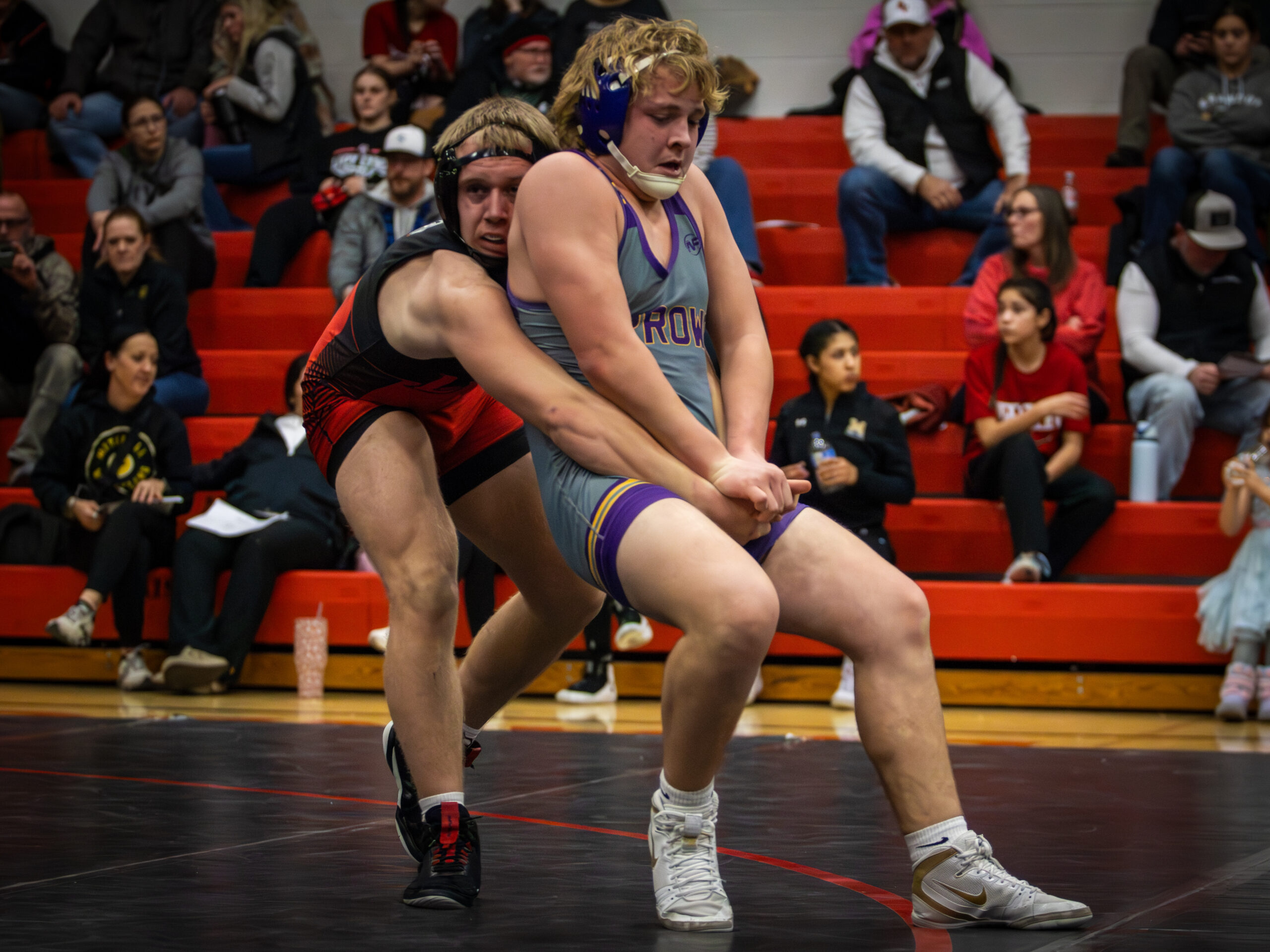 Rylan Johnson of Watertown attempts to escape from his Brandon Valley Opponent