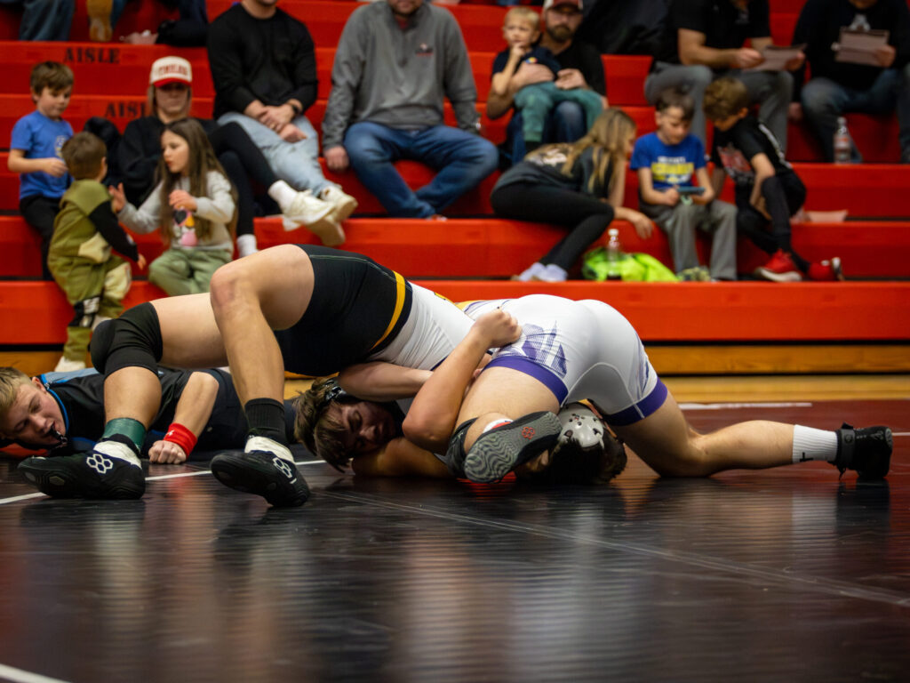Watertowns Cade Kuemper pins his opponent from Mitchell