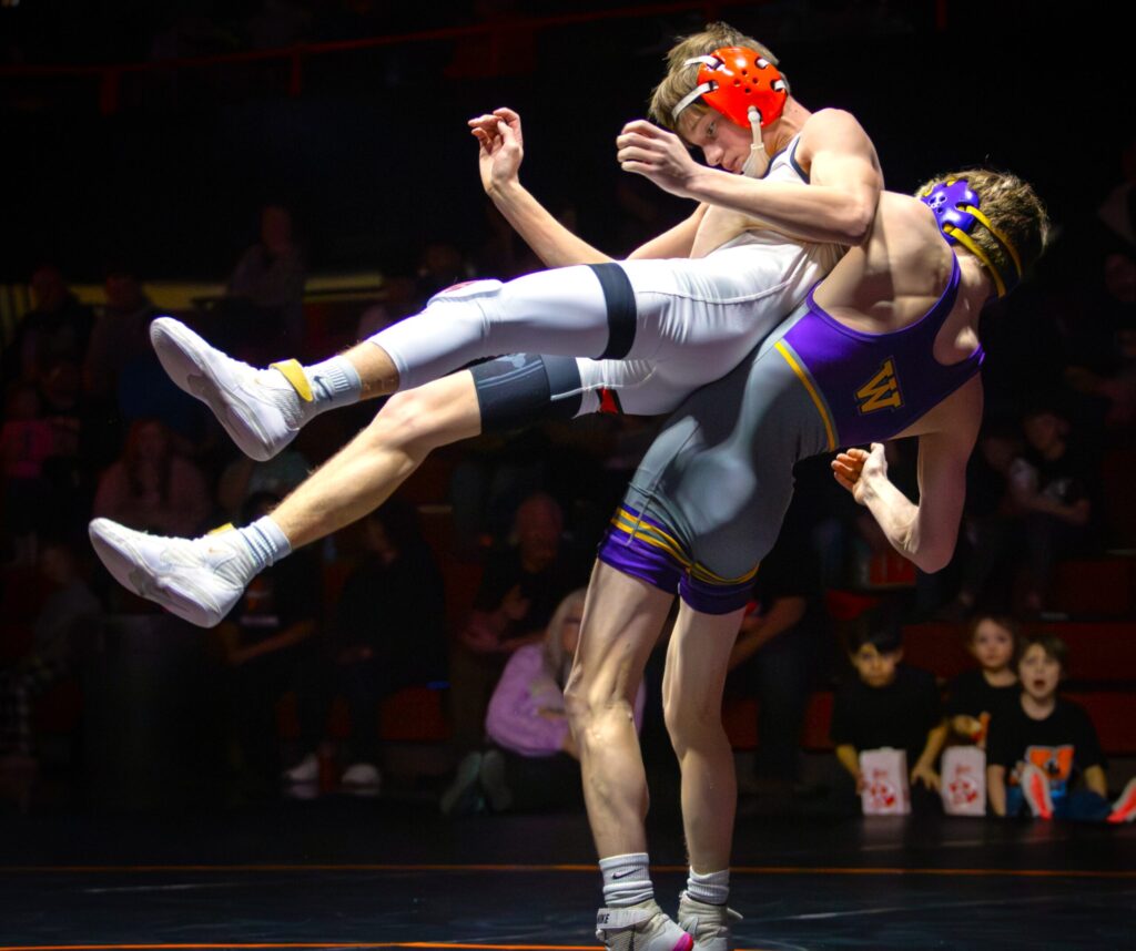 Braylon Schell of Watertown returns his opponent of Huron to the mat