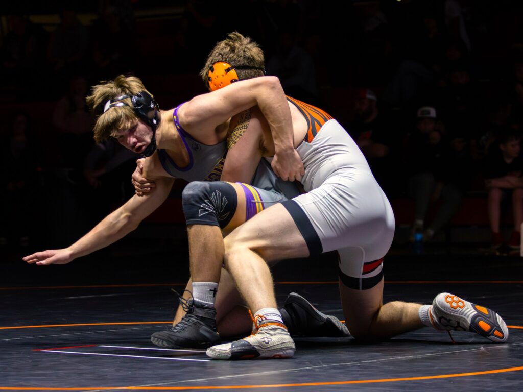 Watertowns Cade Kuemper looks to escape from his opponent of Huron