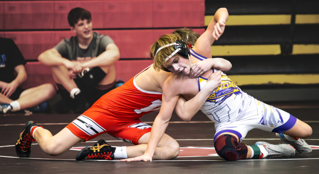 Watertowns Jonah Anderson looks for an escape from Damian Janish of Yankton