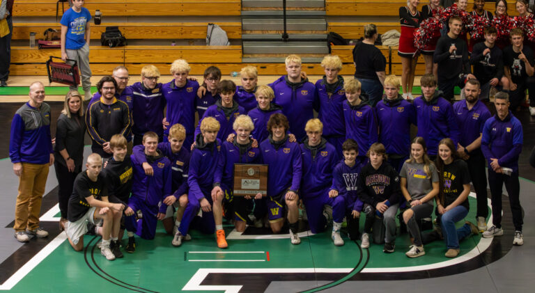 The Arrows show off their third place trophy.