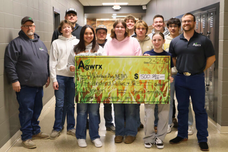Watertown Area NETHS FFA Members accept a donation from Darrel Kittelson Agwrx Watertown Grain Location Manager and Matthew Nelson Agwrx Watertown Agronomy Location Manager