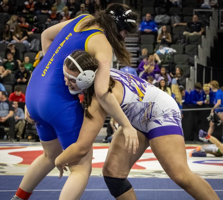 Allison Konrad of Watertown looks to score a takedown on her opponent from Aberdeen Central she went on to win the match which was her 150th varsity win