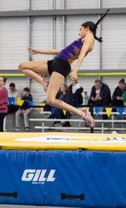 Mayla McGhee successfully jumps over the bar during high jump
