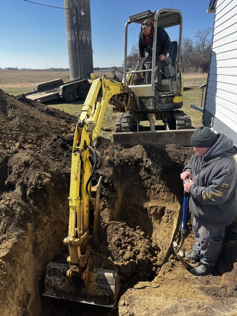 Dustin and Les Nelson digging for treasure