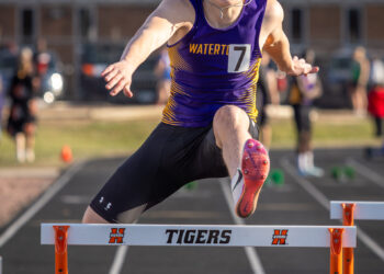 Gage Robison while running hurdles