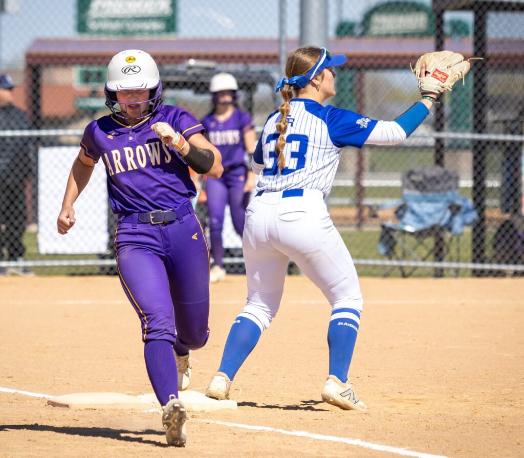 Lauryn Hirsch beats the ball to first base