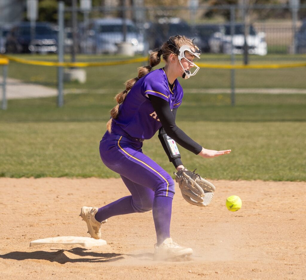 Logan Schell prepares to catch the ball and touch second base
