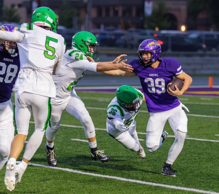 Holton Schutt returns the ball