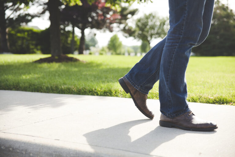 jeans pedestrian shoes sidewalk walking walkway 1062341